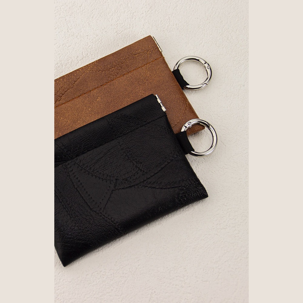Black and tan leather snap pouches